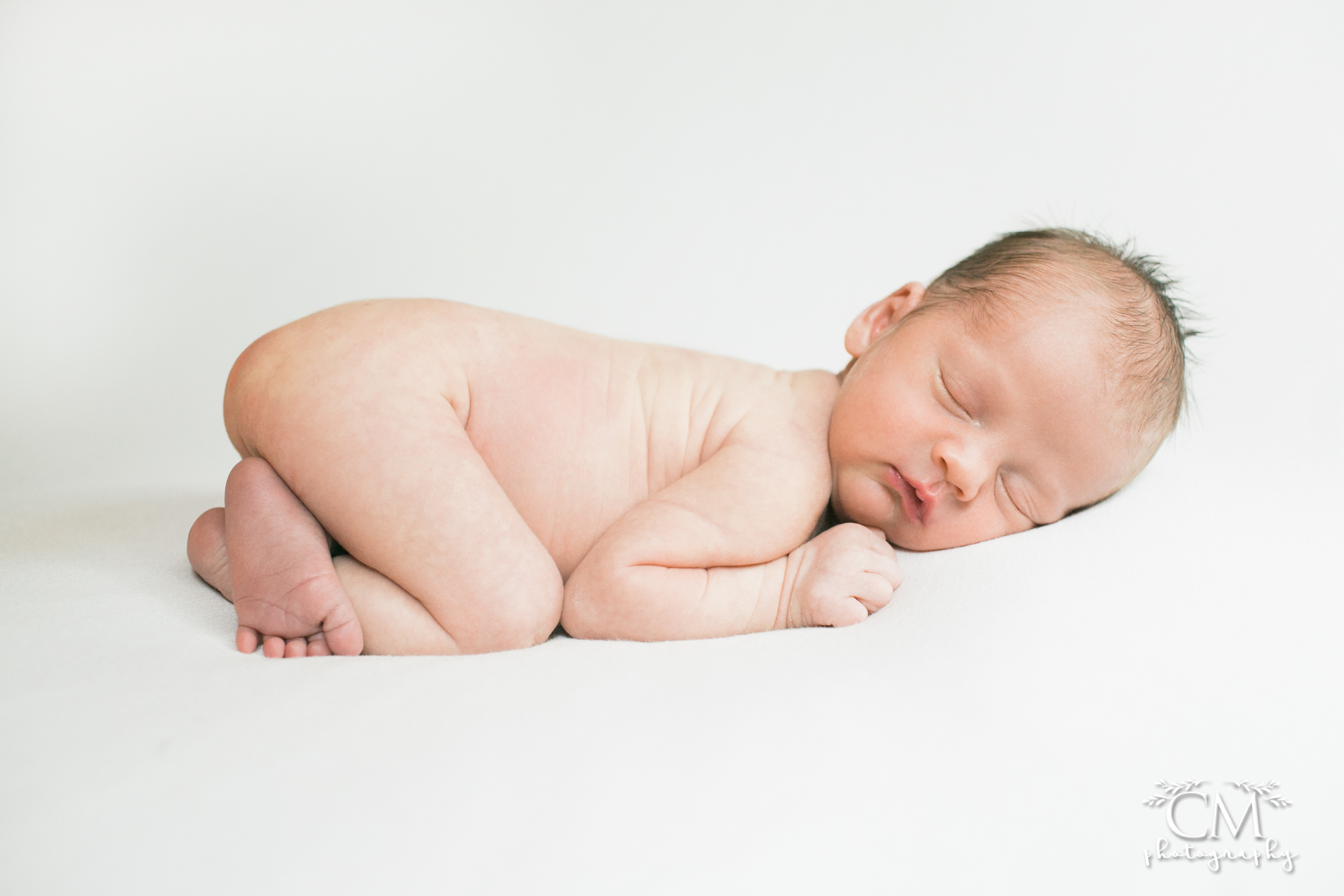 newborn baby boy on white