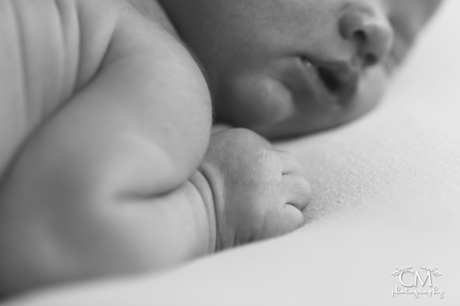newborn baby fist black and white