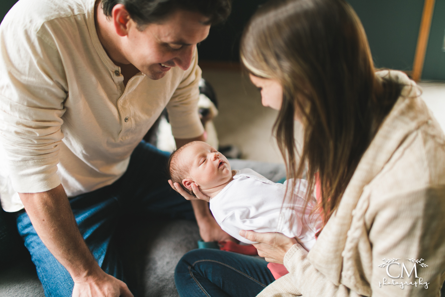 new parents loving newborn baby