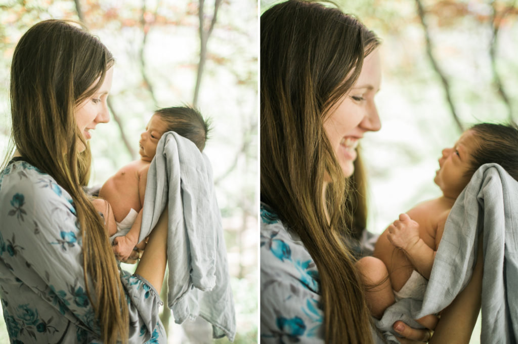 mom laughing at new baby