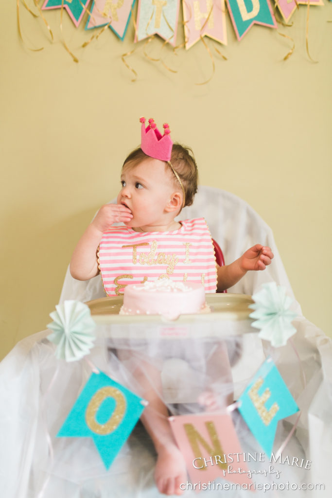 birthday girl with crown eating cake 