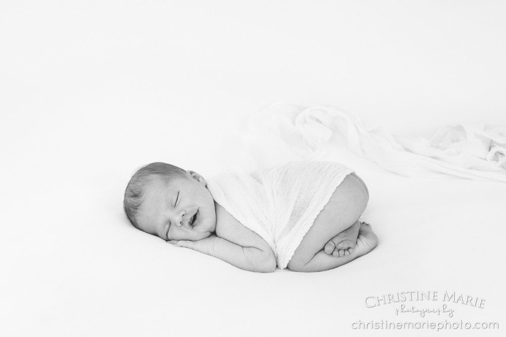 smiling sleeping newborn baby 