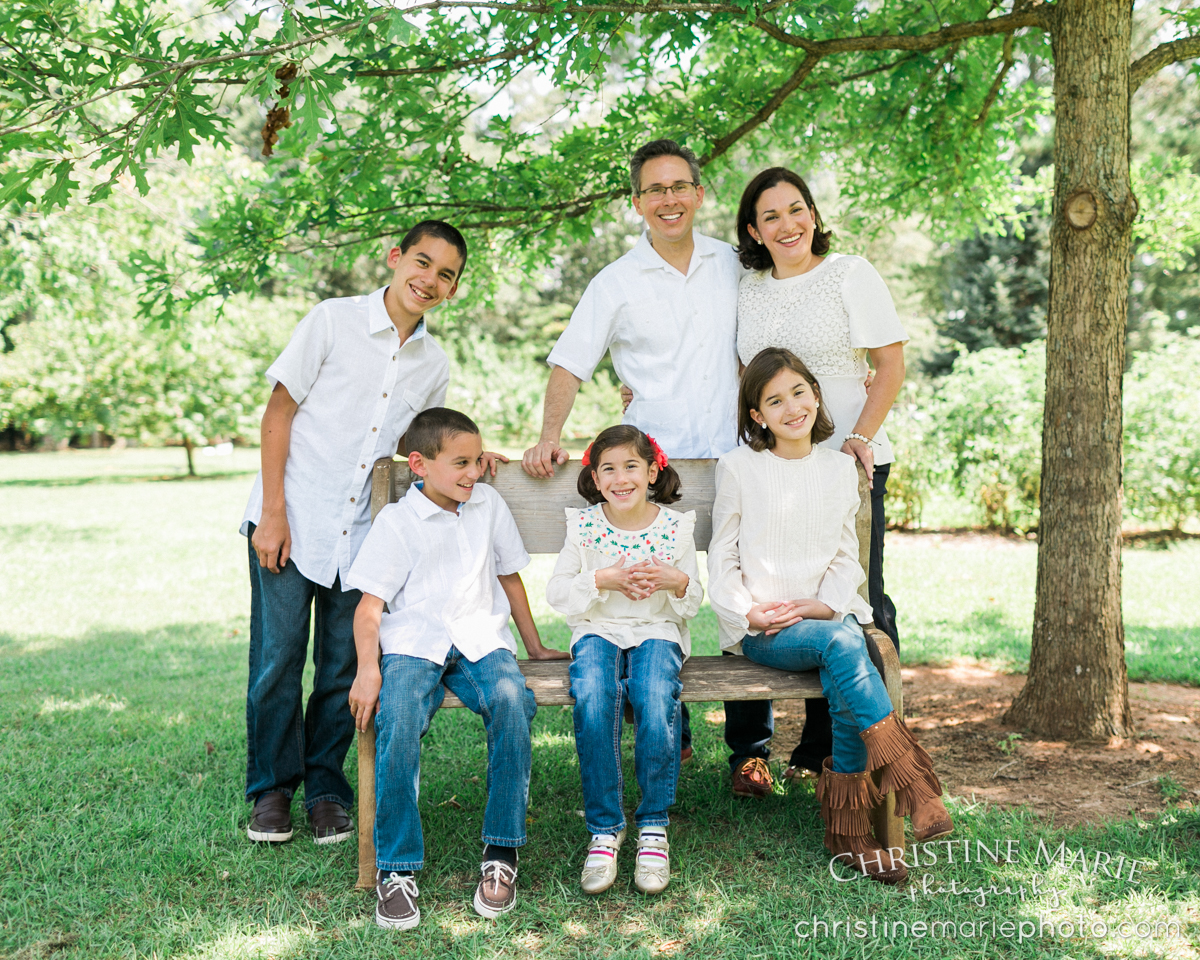 large family outdoor photo under tree