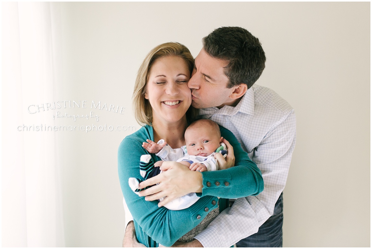 happy portrait of family with newborn