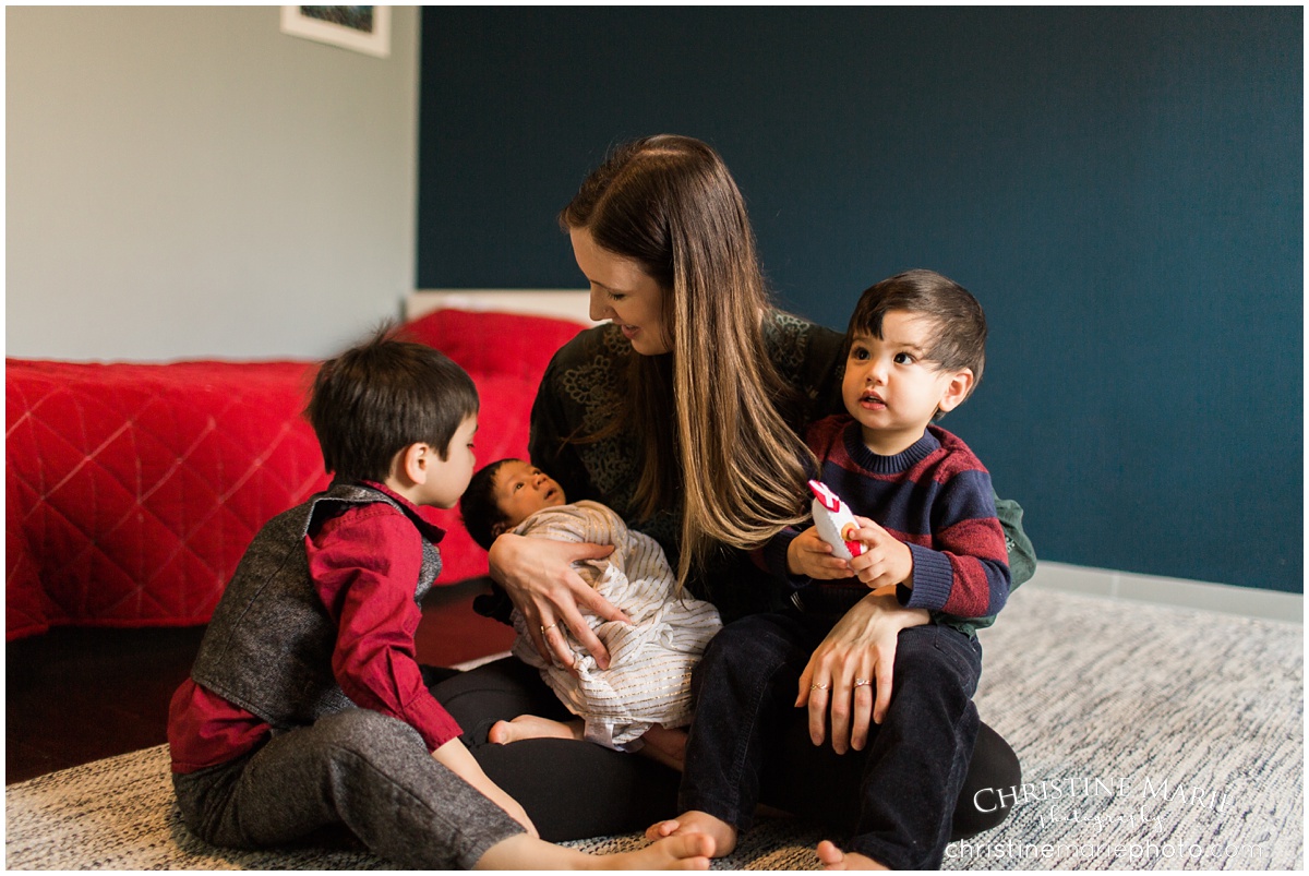 mother with 3 sons and newborn