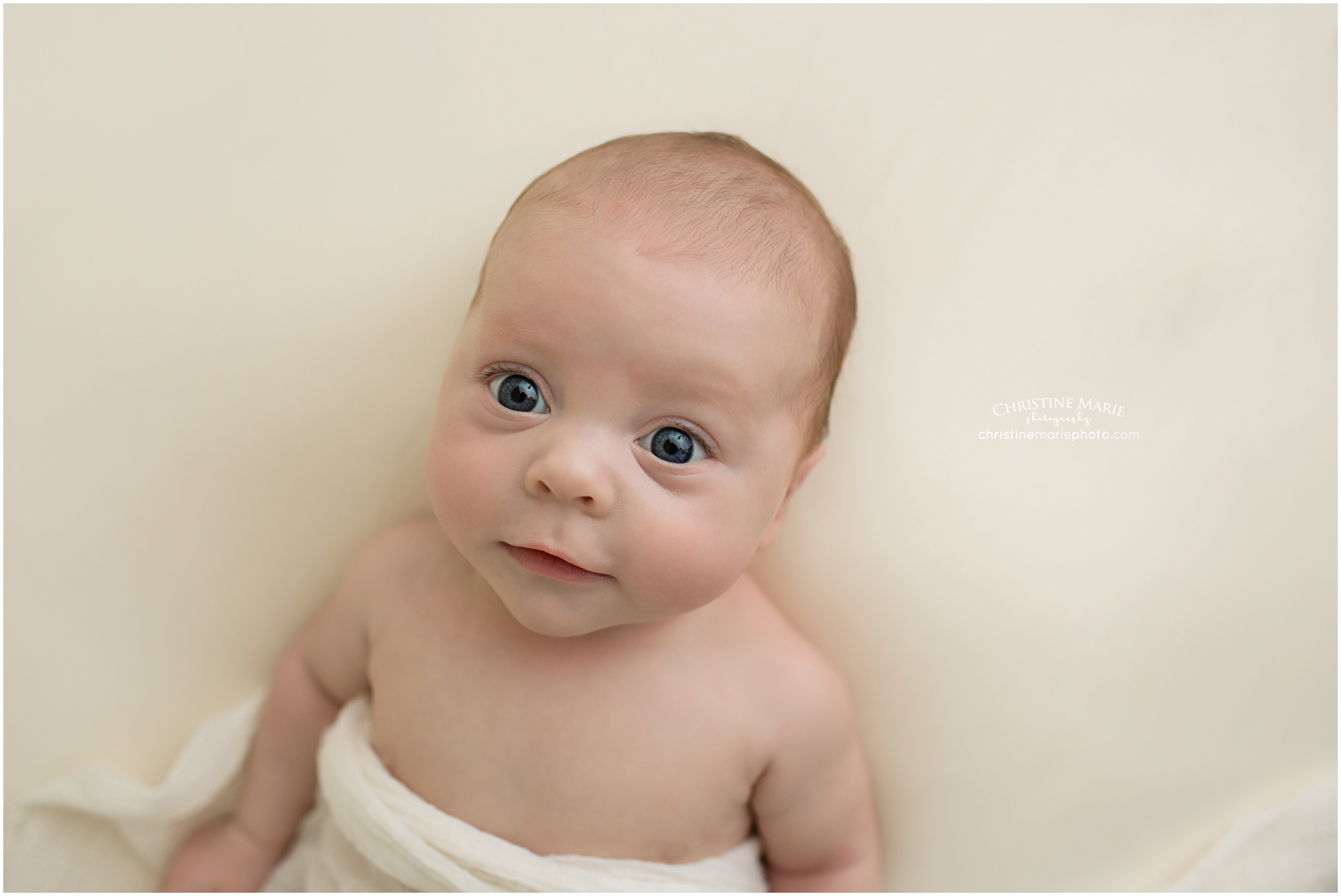 cumming newborn photographer, wide eyed natural baby girl 