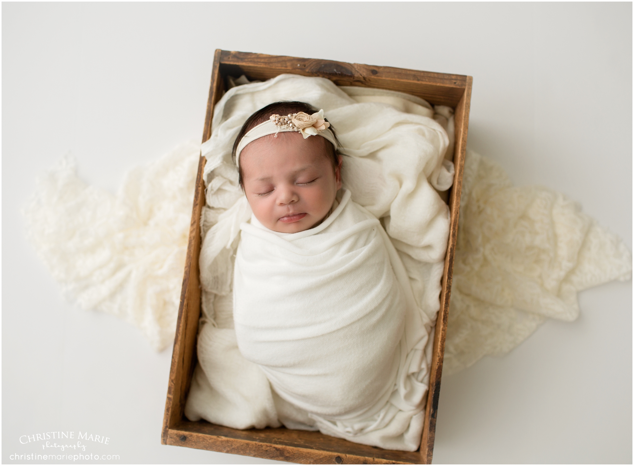 sleeping baby in wooden box, cumming newborn photographer 