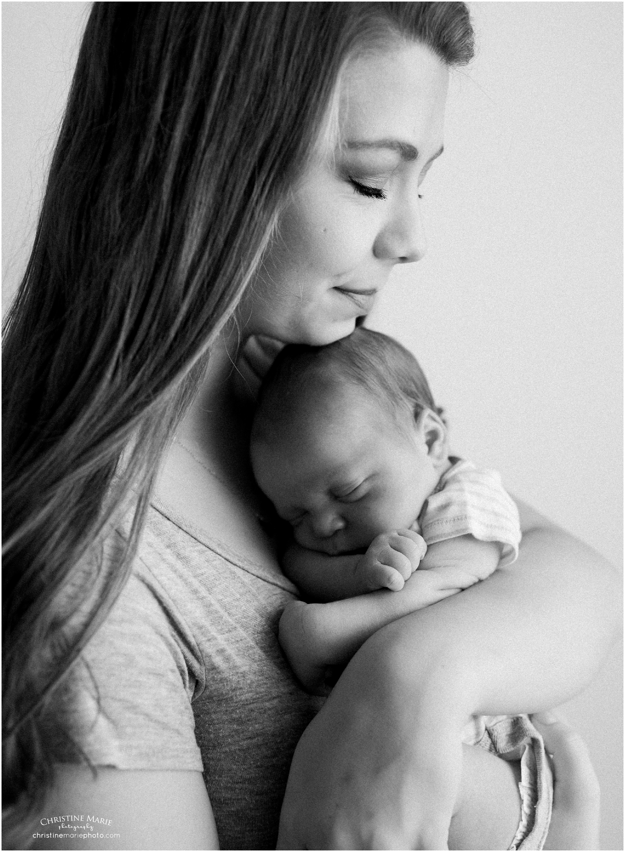mother embracing newborn son, christine marie photography