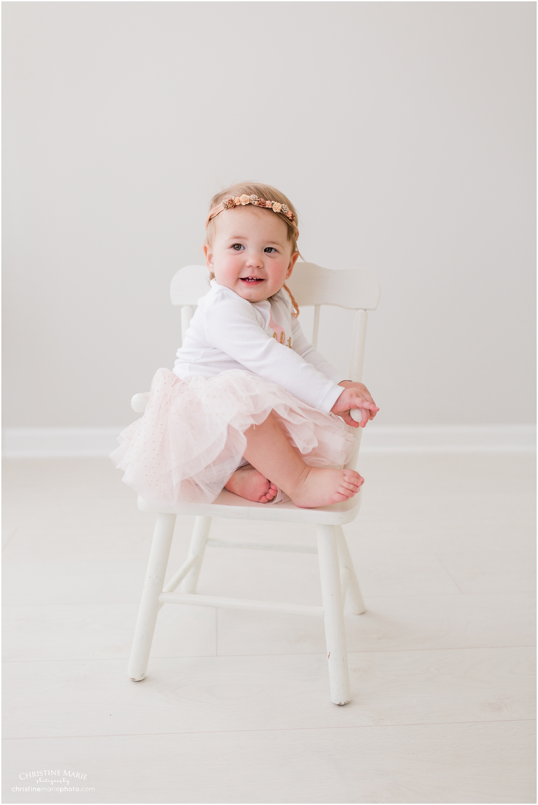cute toddler girl in white studio