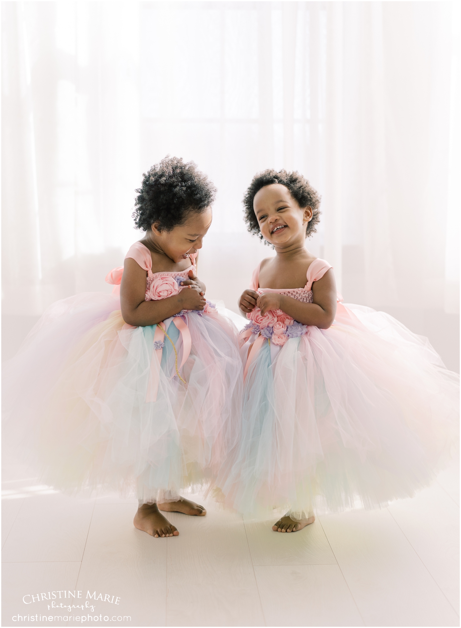little girls in tutu dresses laughing 