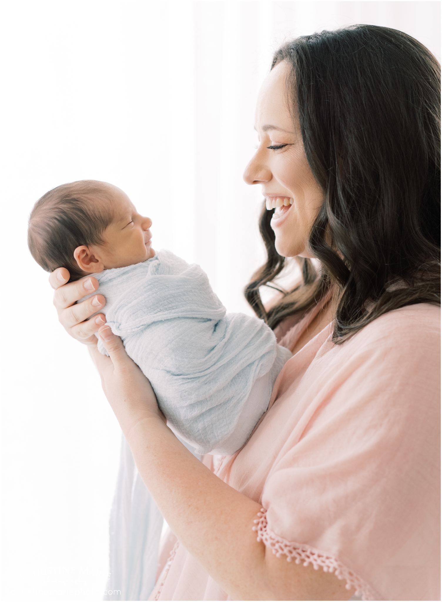 smiling mom and baby