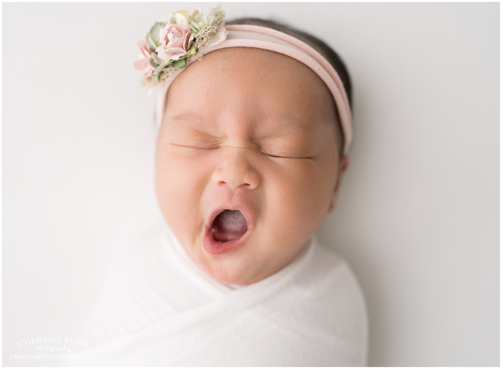 sleepy newborn yawn