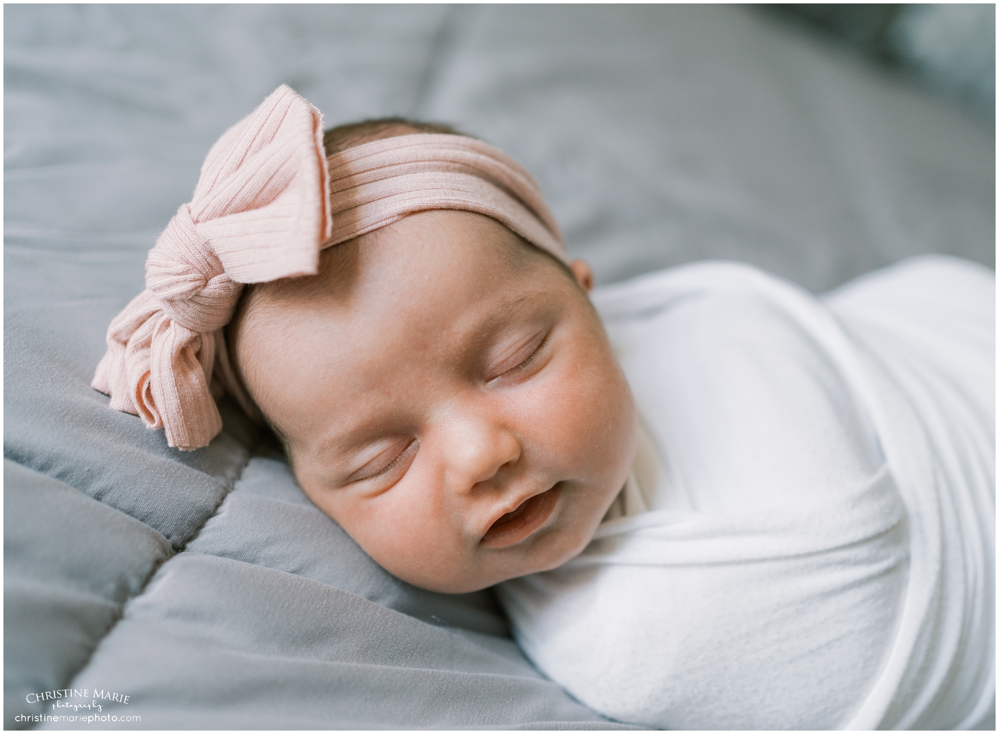 precious baby girl asleep on bed