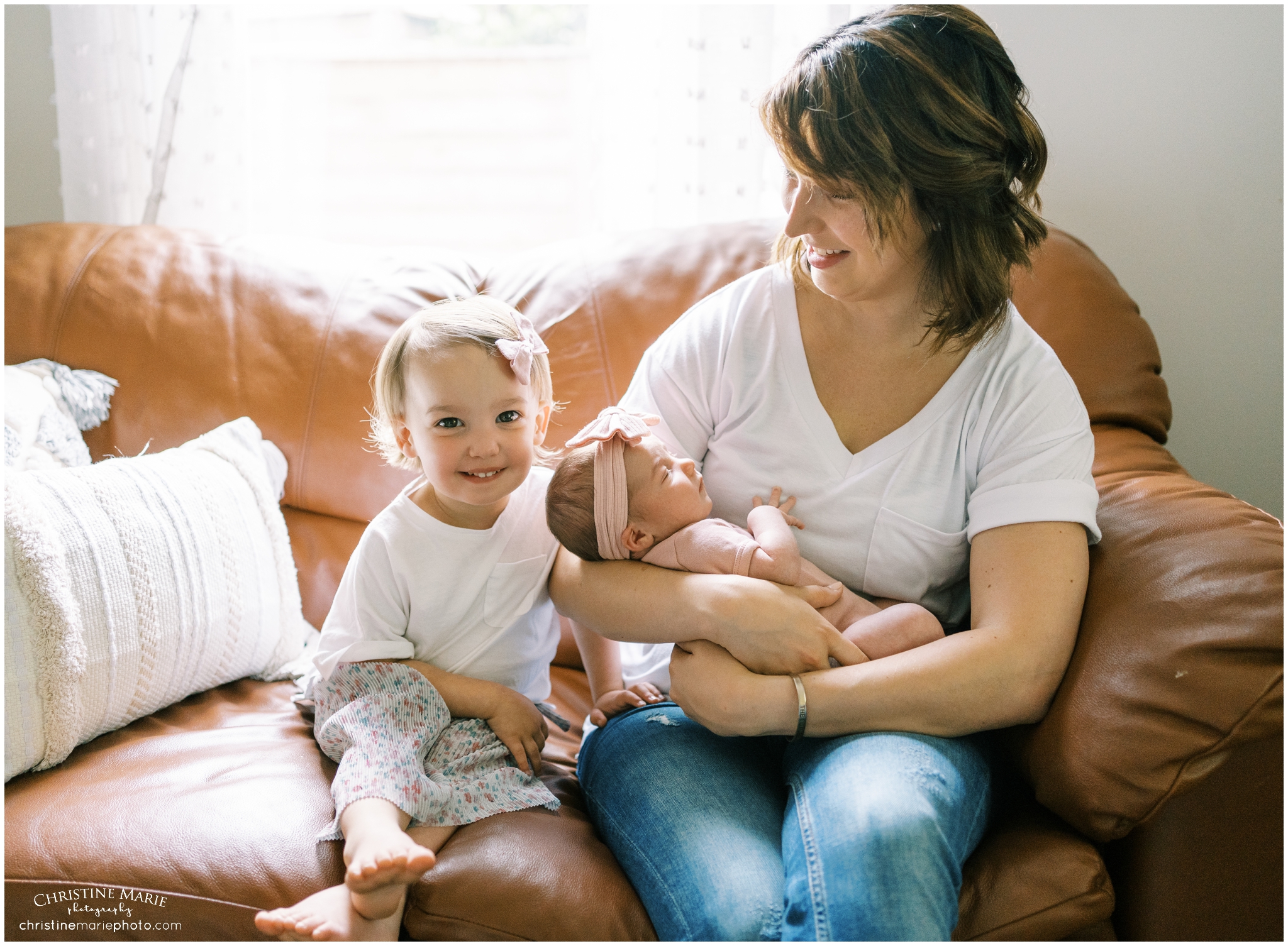 proud mom with two baby girls in atlanta newborn photo session