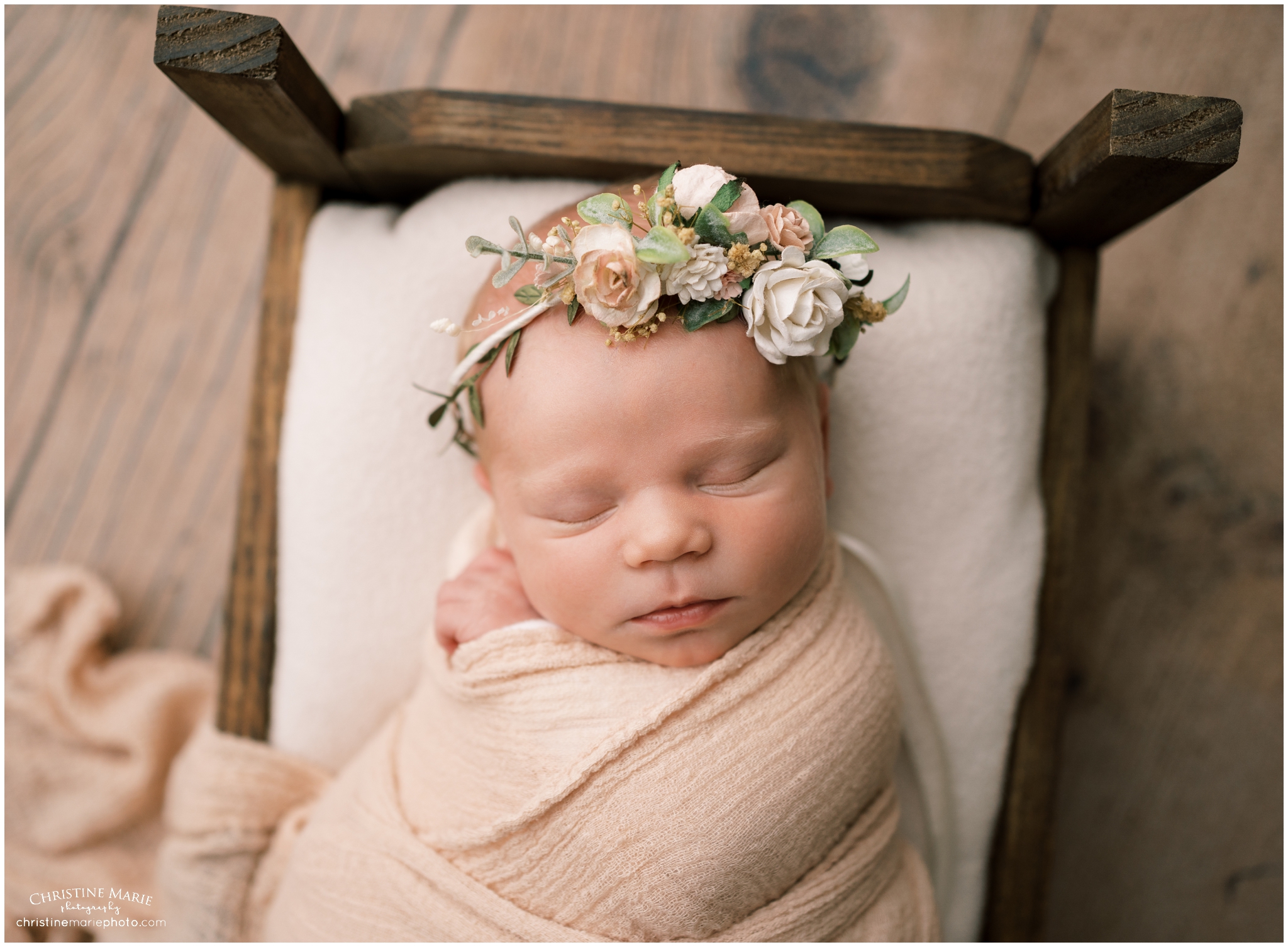 atlanta studio newborn photography with wooden bed prop