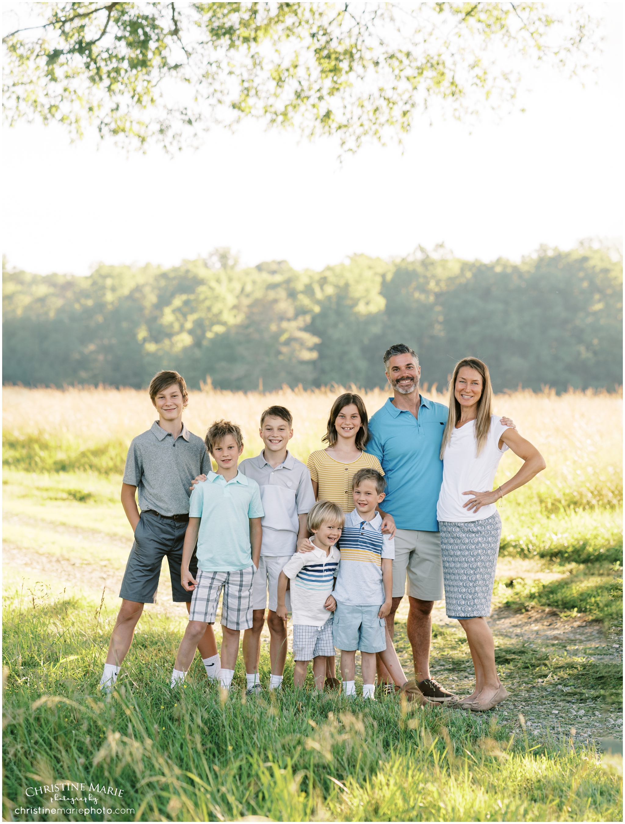 large family photo in a field in Cumming, GA