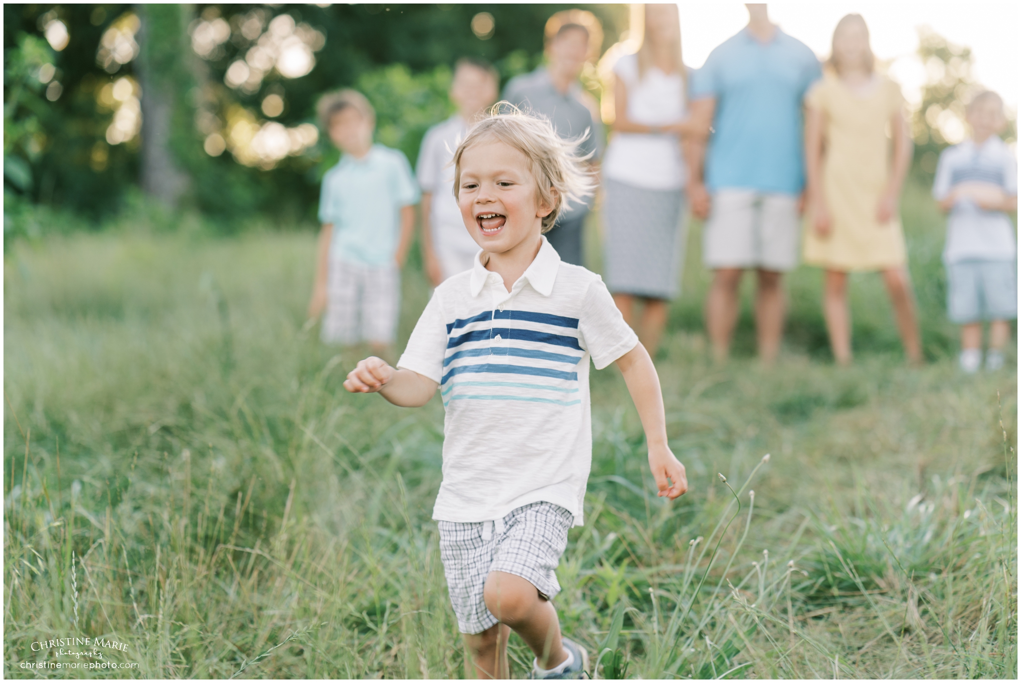 little boy running away from family photo in cumming ga