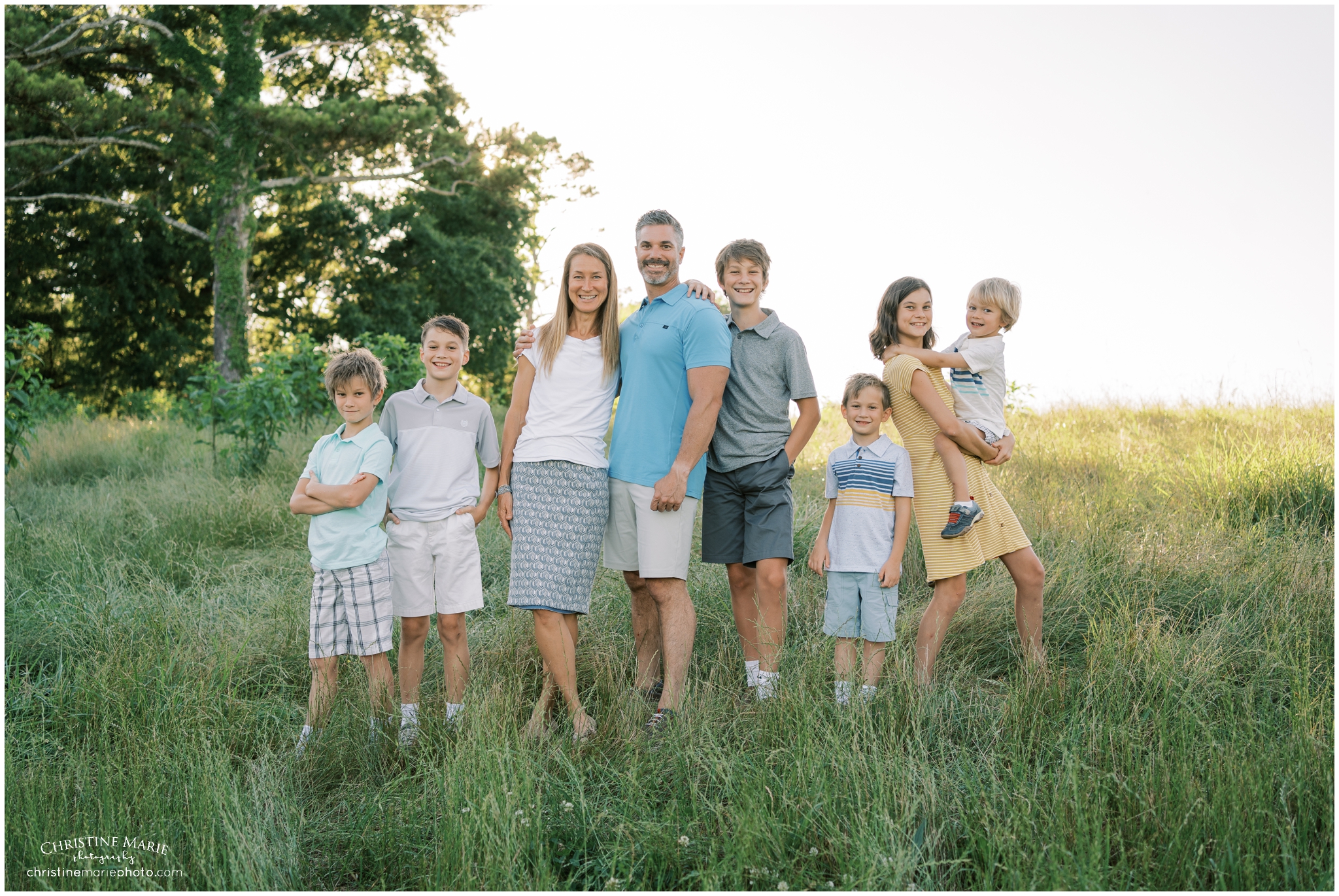 large family photo in a field in Cumming, GA