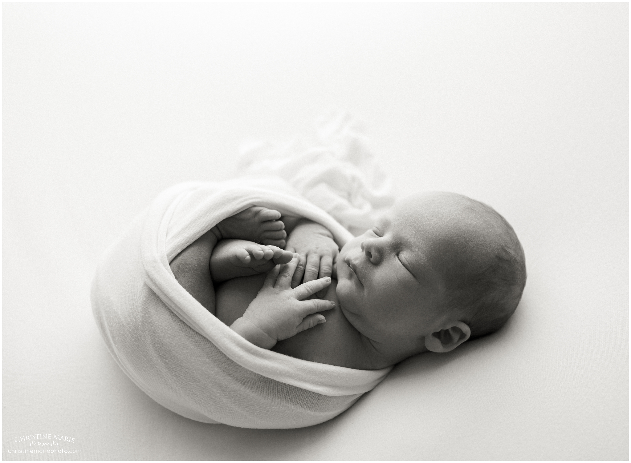 natural black and white image of newborn baby in cumming ga