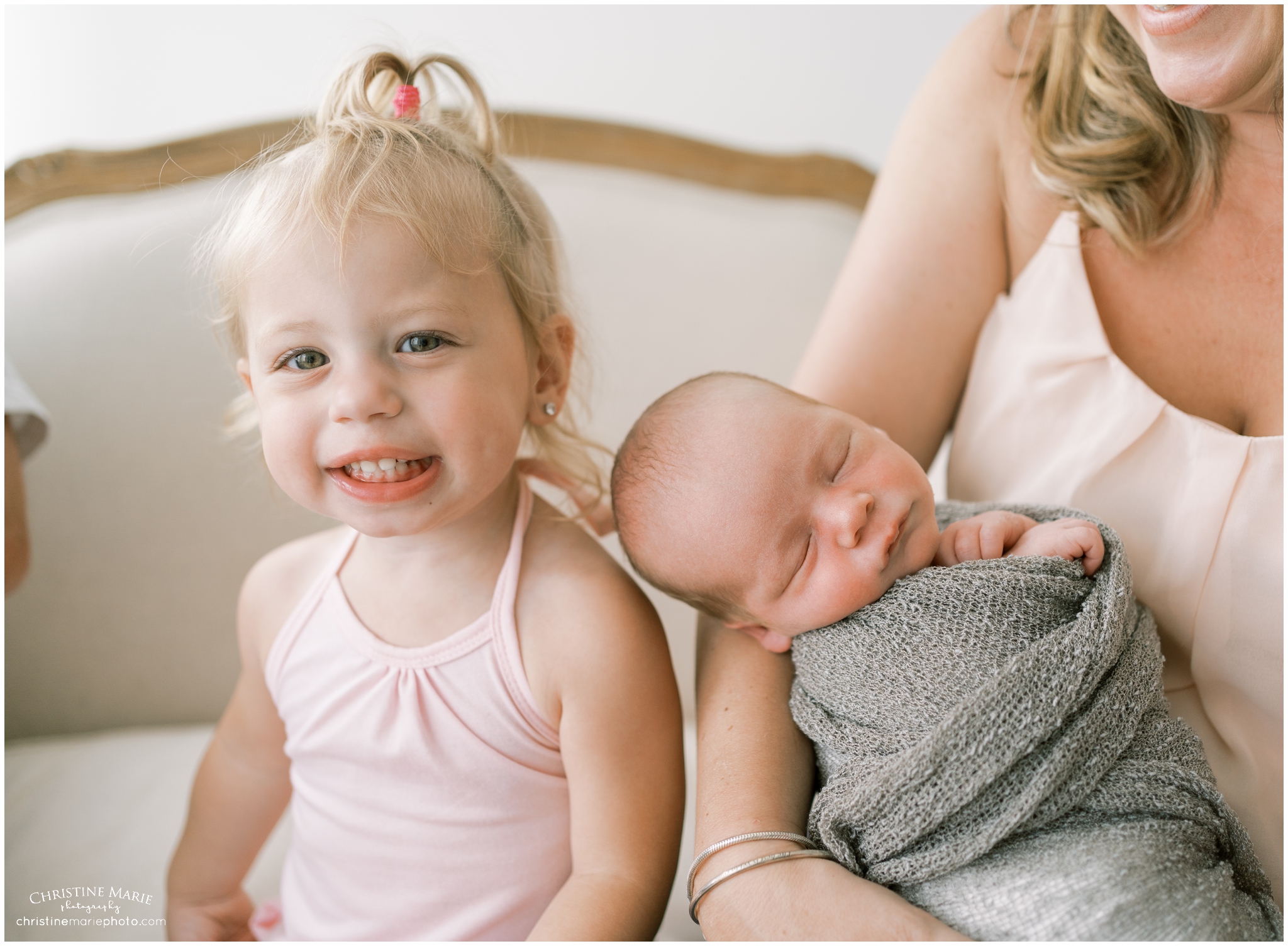 cumming newborn photography in studio with siblings