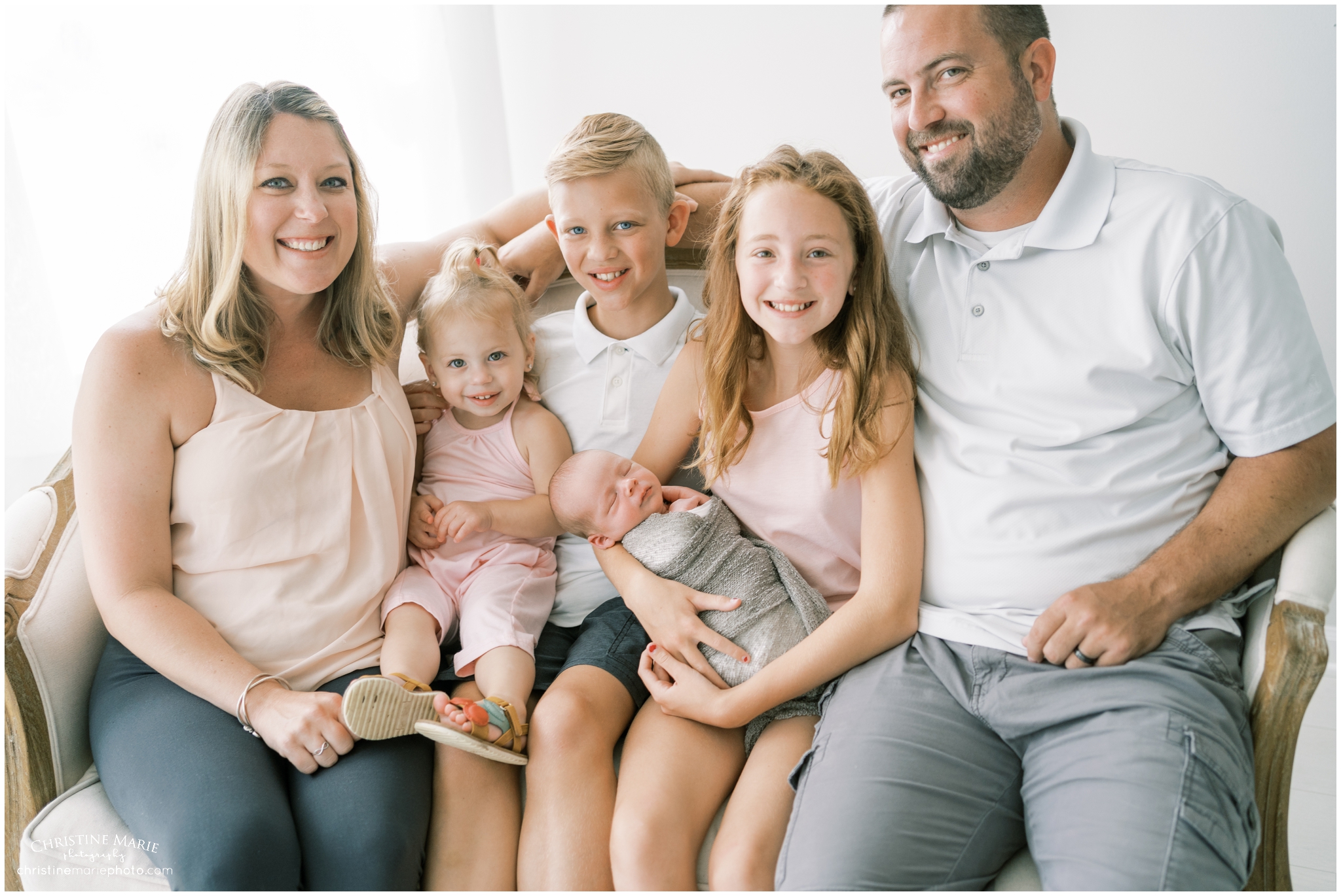 happy family with newborn baby in studio photography in Atlanta