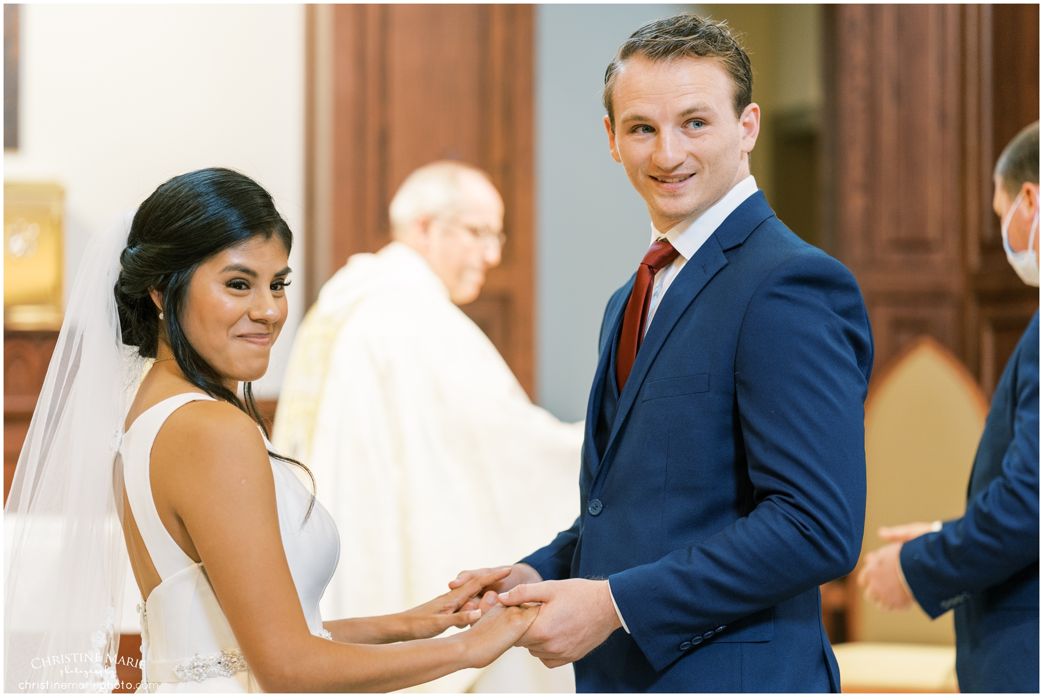 bride and groom preparing to get married on the alter