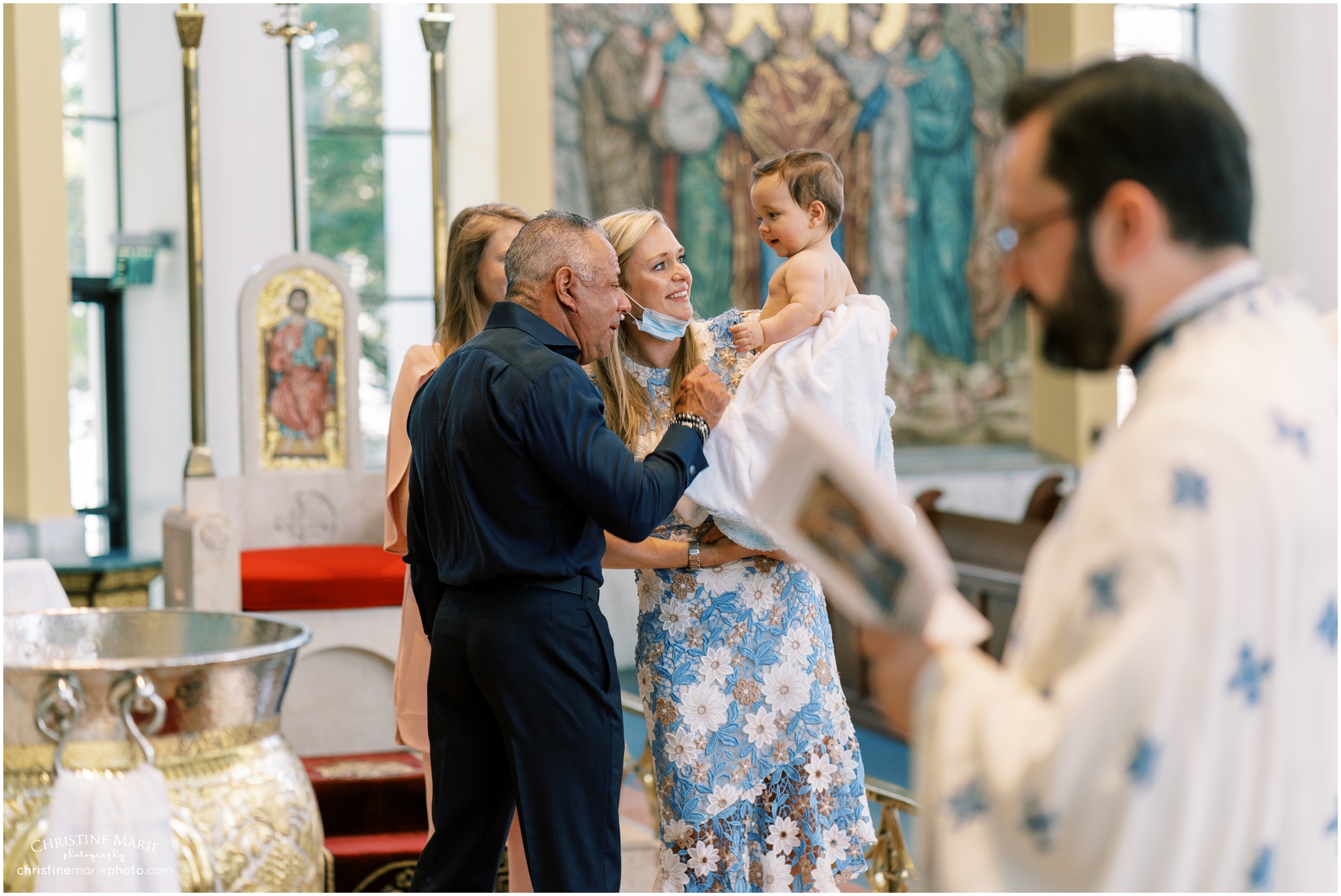 baby boy getting ready to be baptized