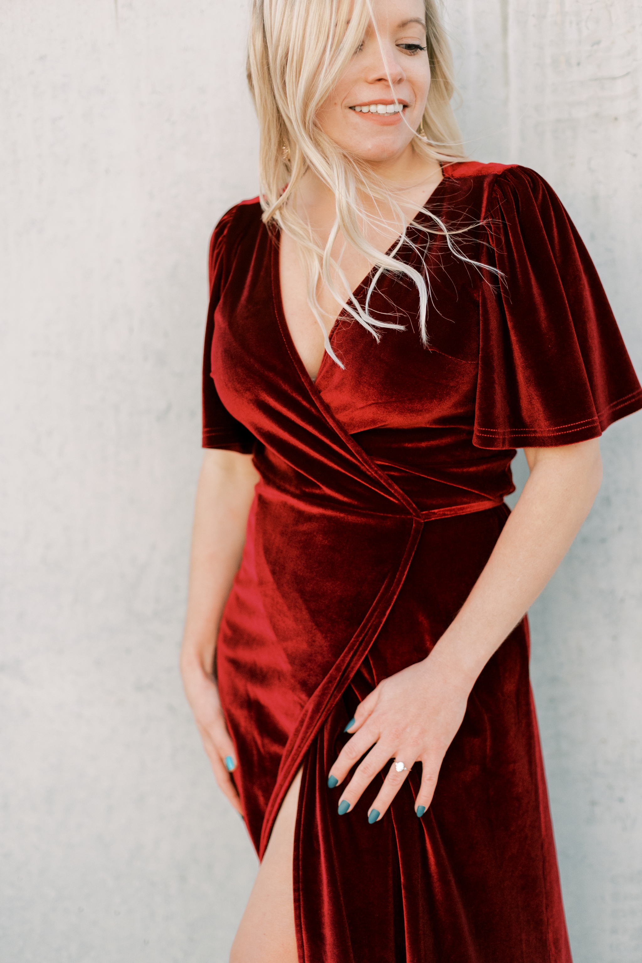 red velvet dress for holiday engagement photos