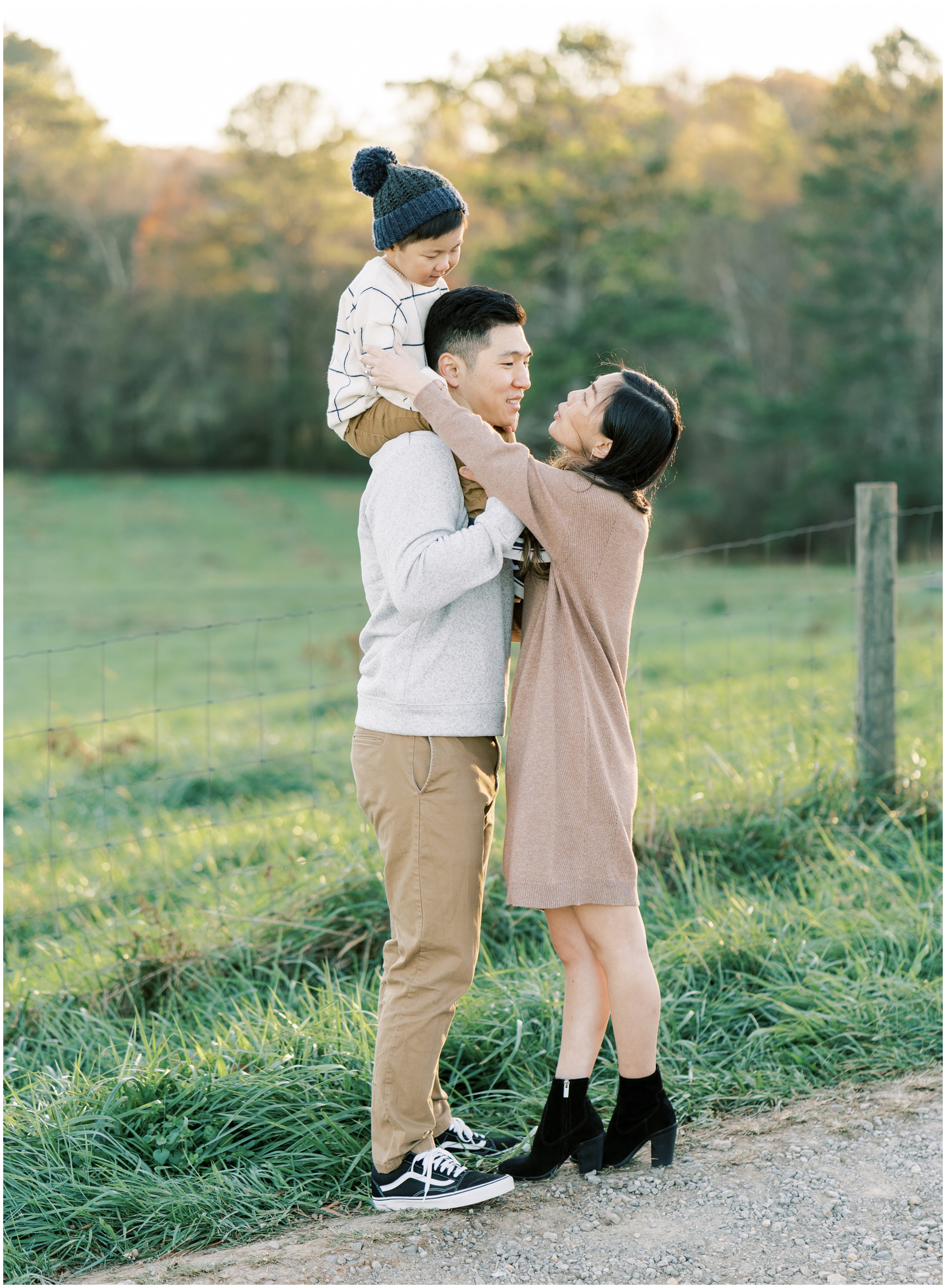 outdoor family photos with boy on dads shoulder