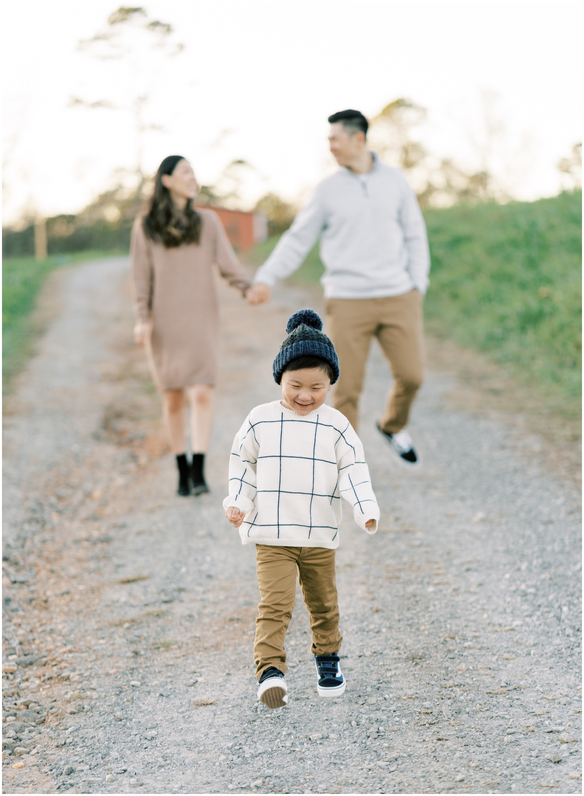 family walking down a road during family photoshoot in cumming ga