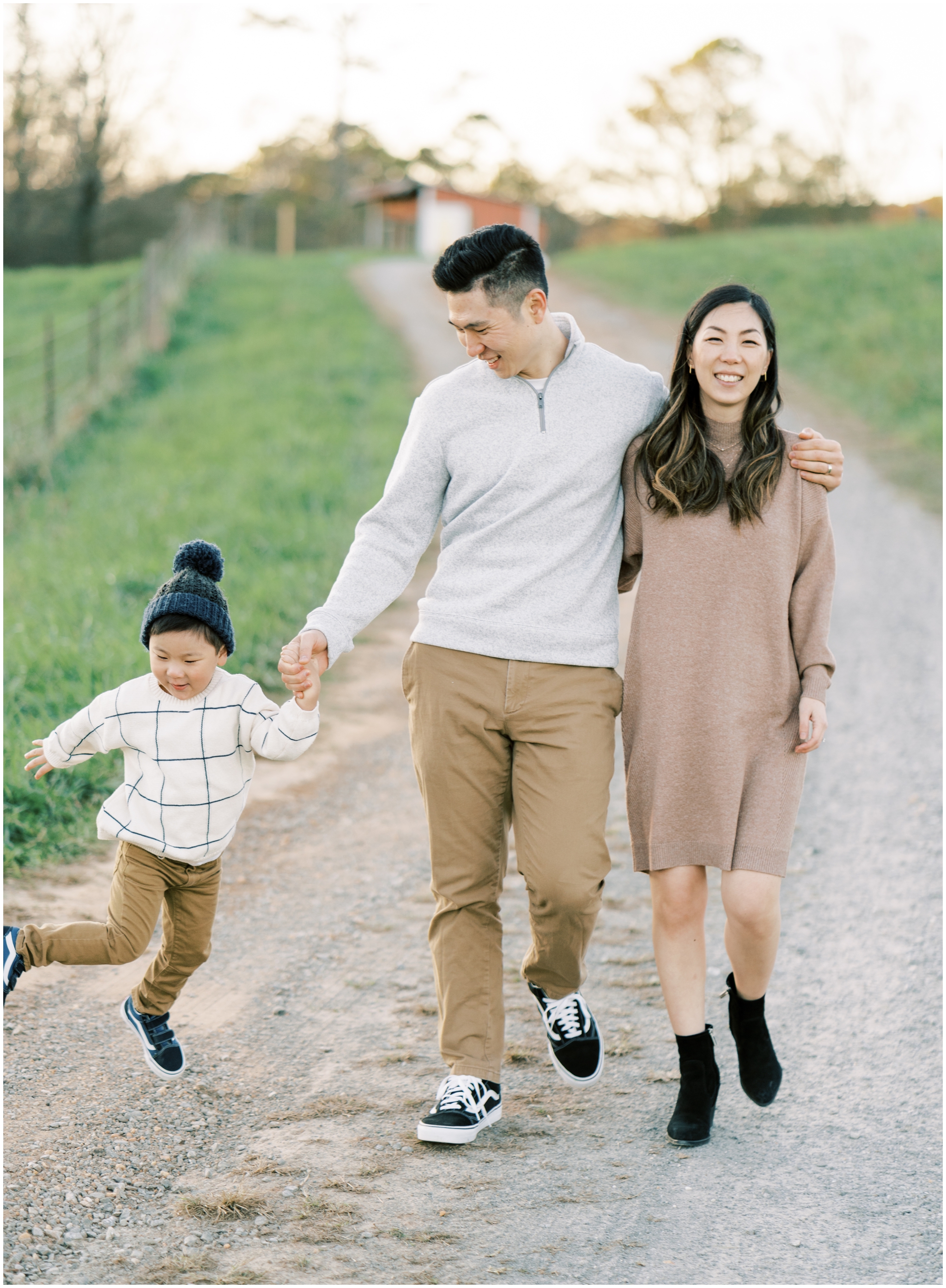 family walking down a road during family photoshoot in cumming ga