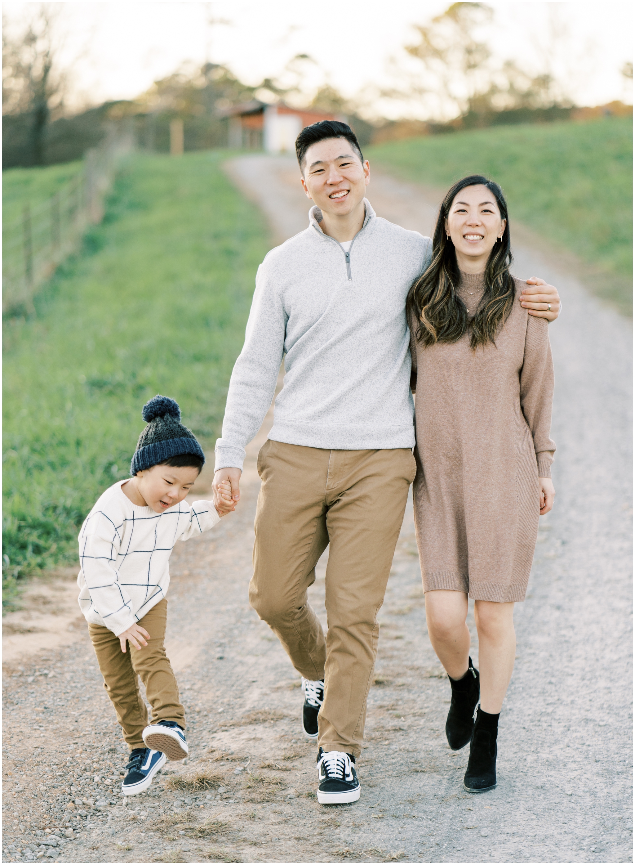 family walking down a road during family photoshoot in cumming ga