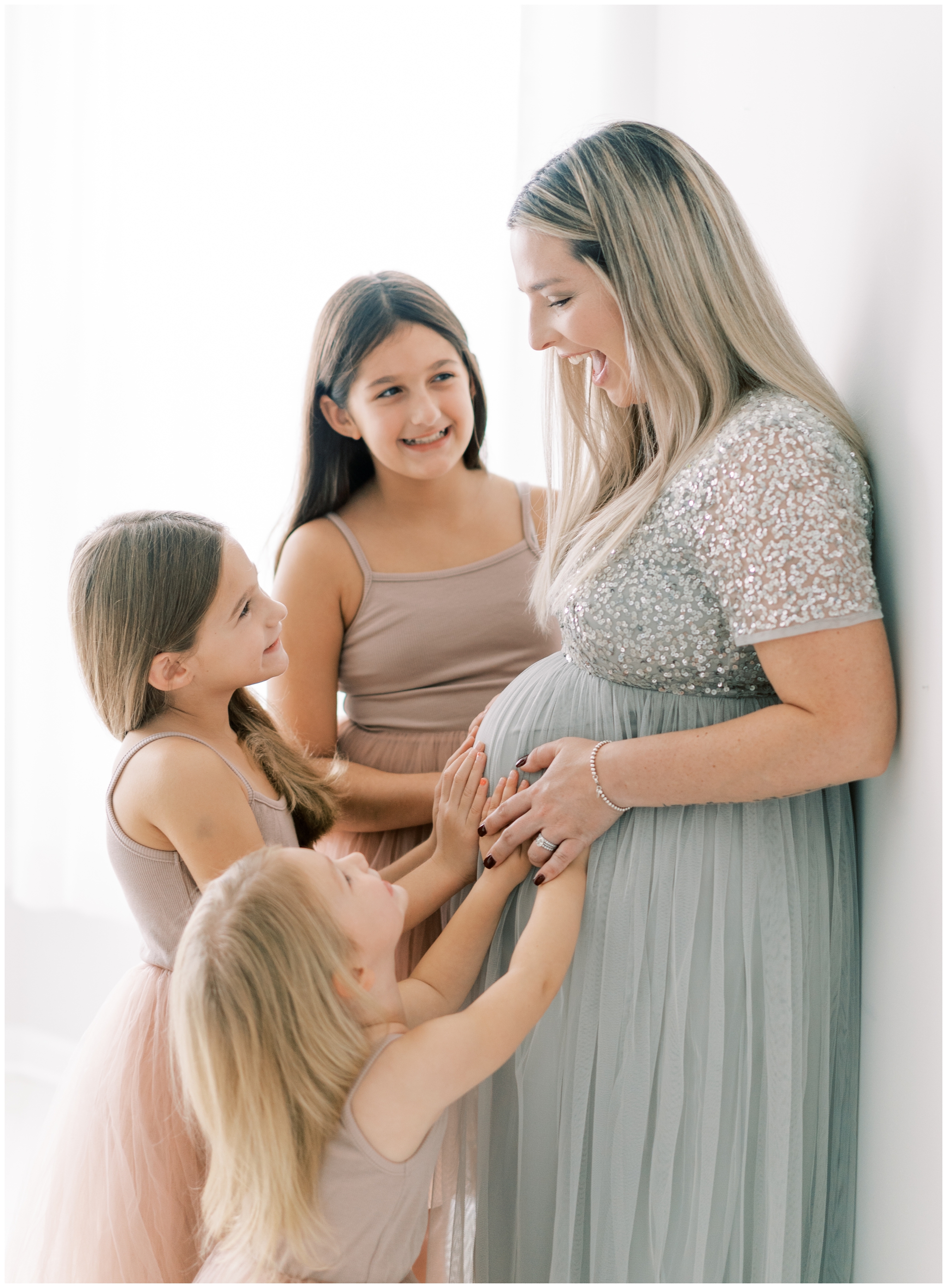 Light and airy studio maternity portraits with children