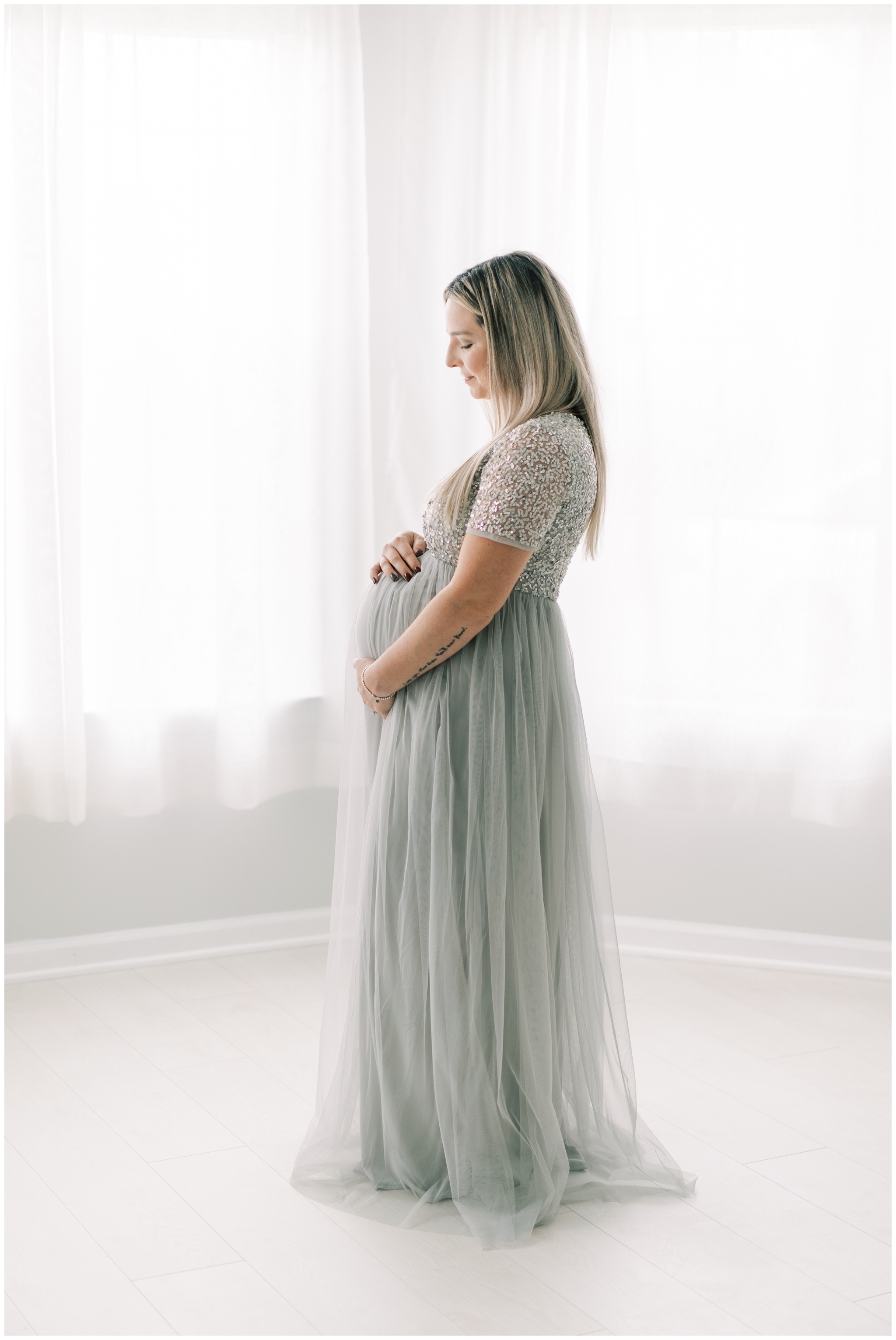 beautiful pregnancy photo in gown in atlanta studio