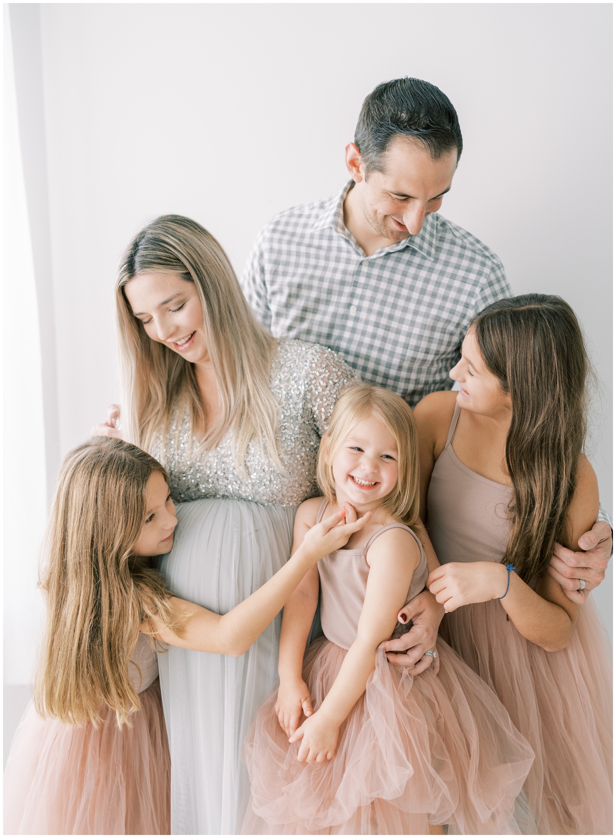 playful maternity and family photo in studio in atlanta