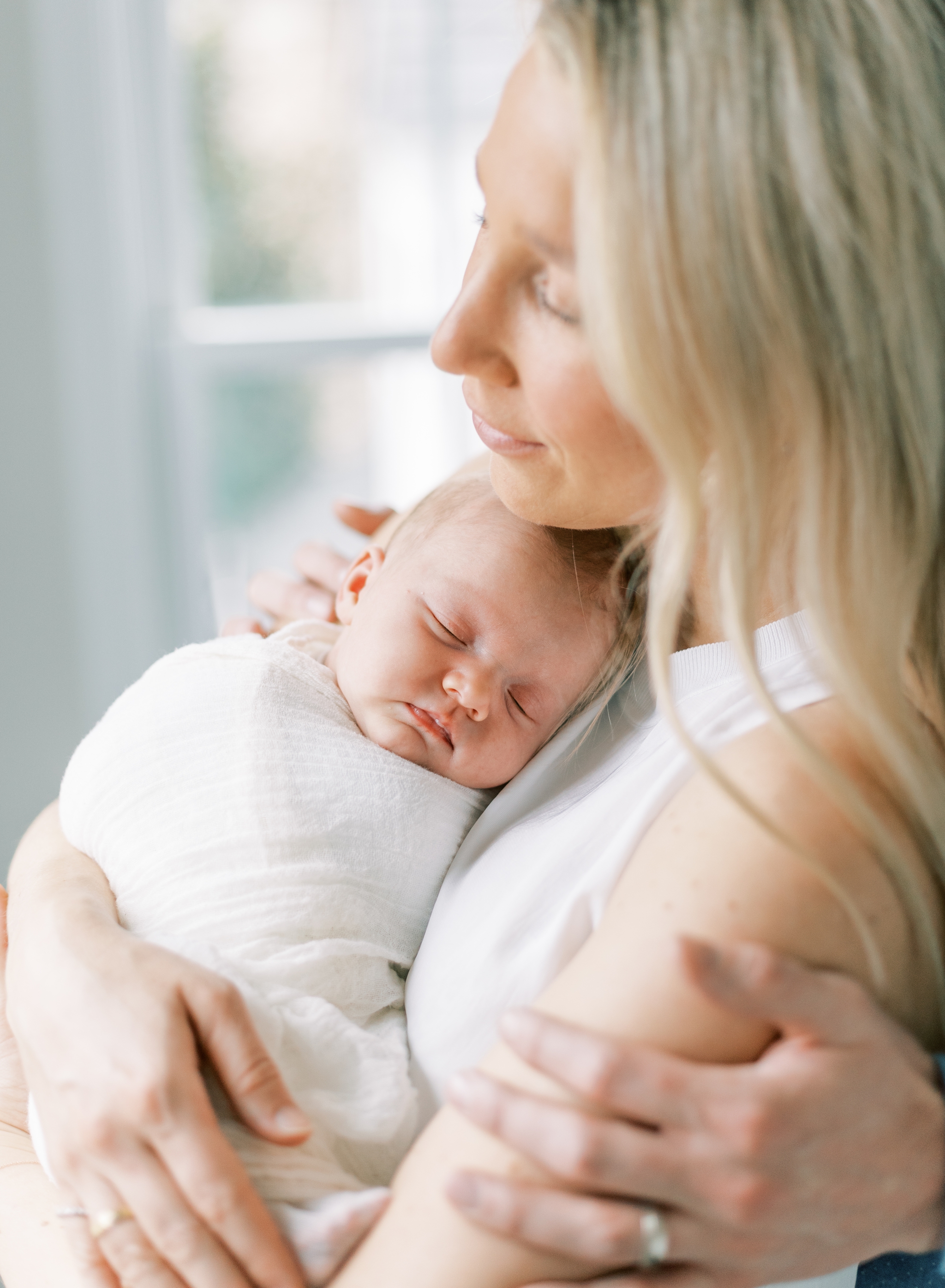 heartfelt portrait of mother holding baby, roswell newborn photographer