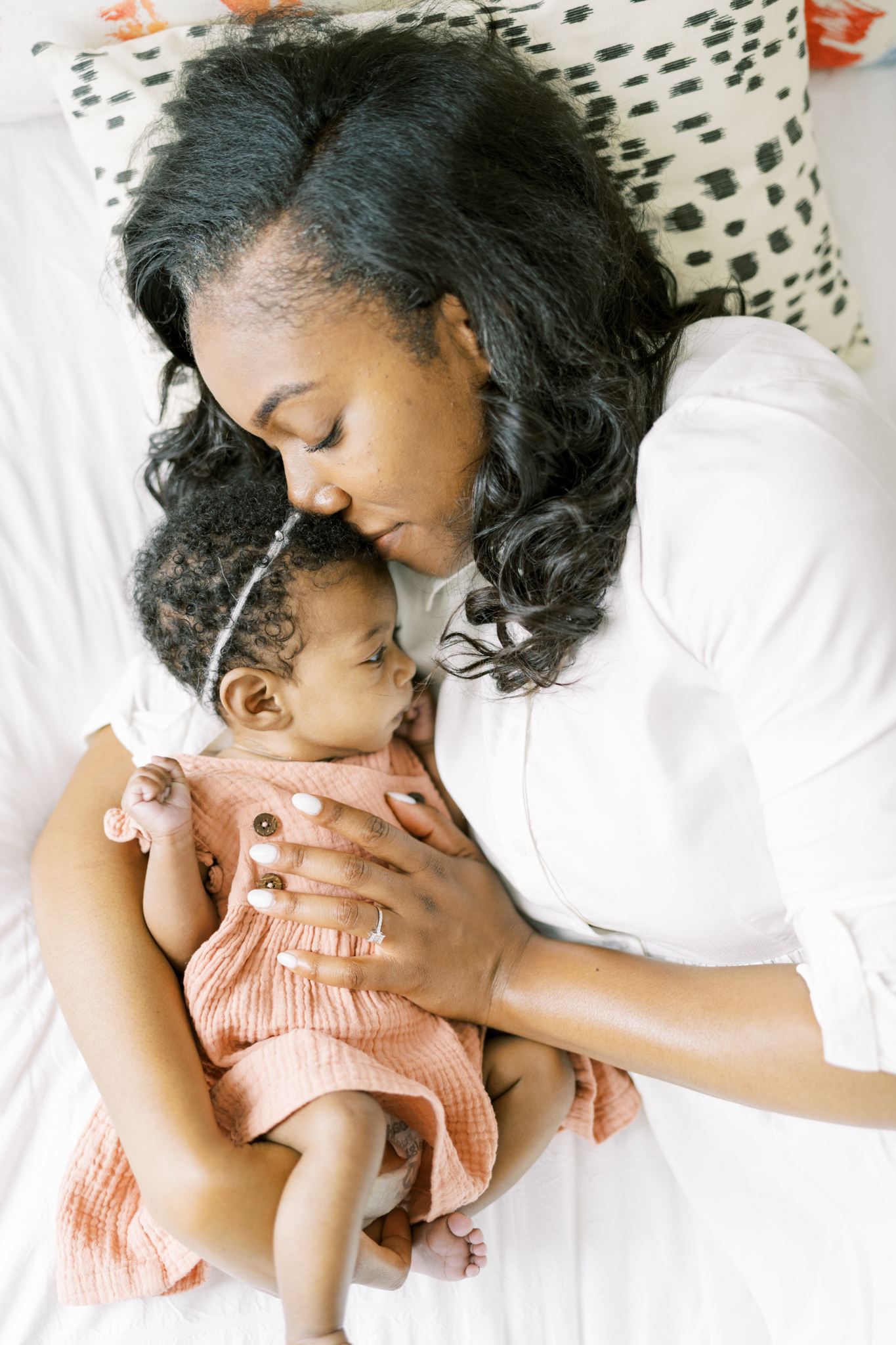 mother cuddling newborn daughter, buckhead atlanta newborn photographer