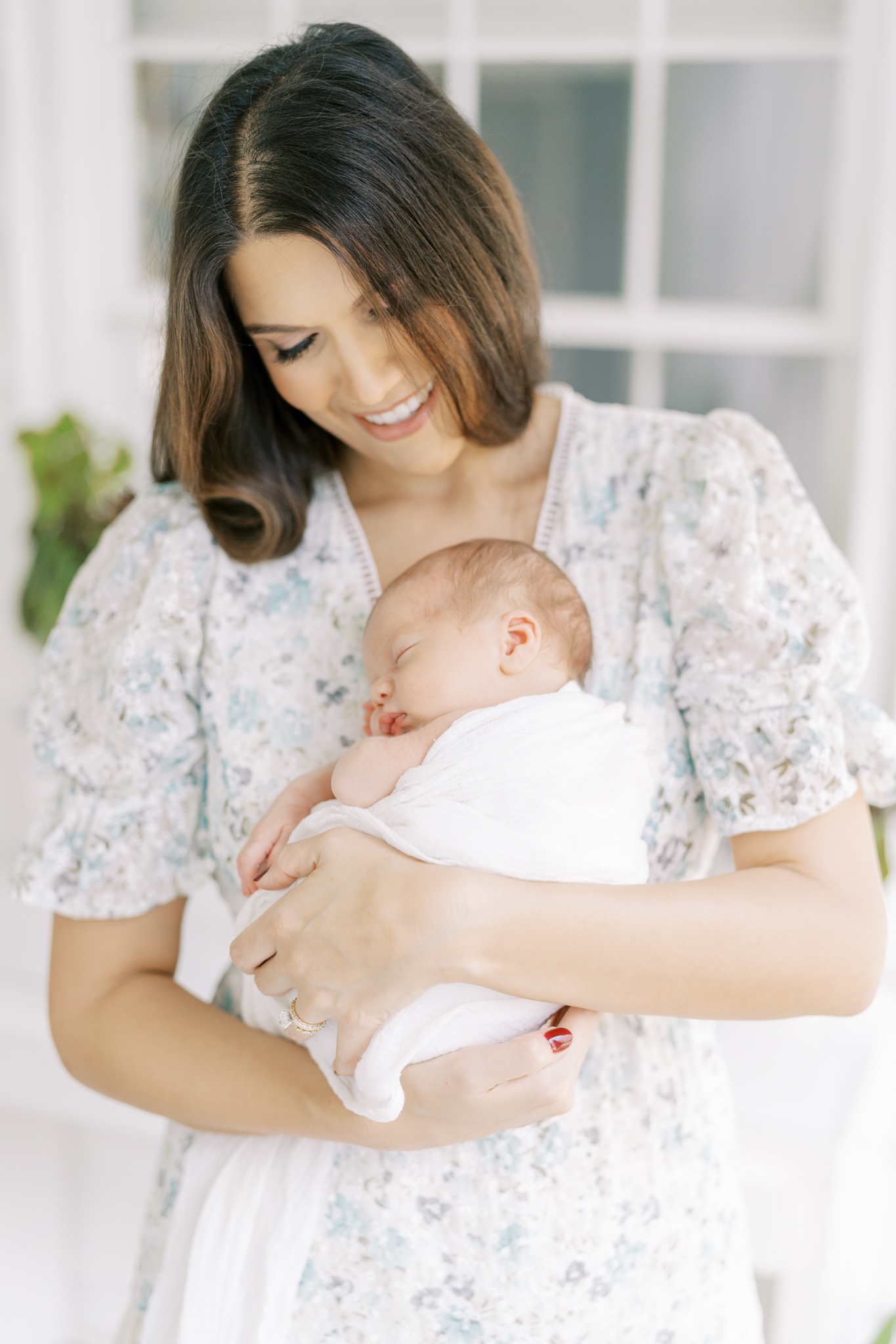 Sweet moment of mom holding her son during photoshoot in her Atlanta home. 