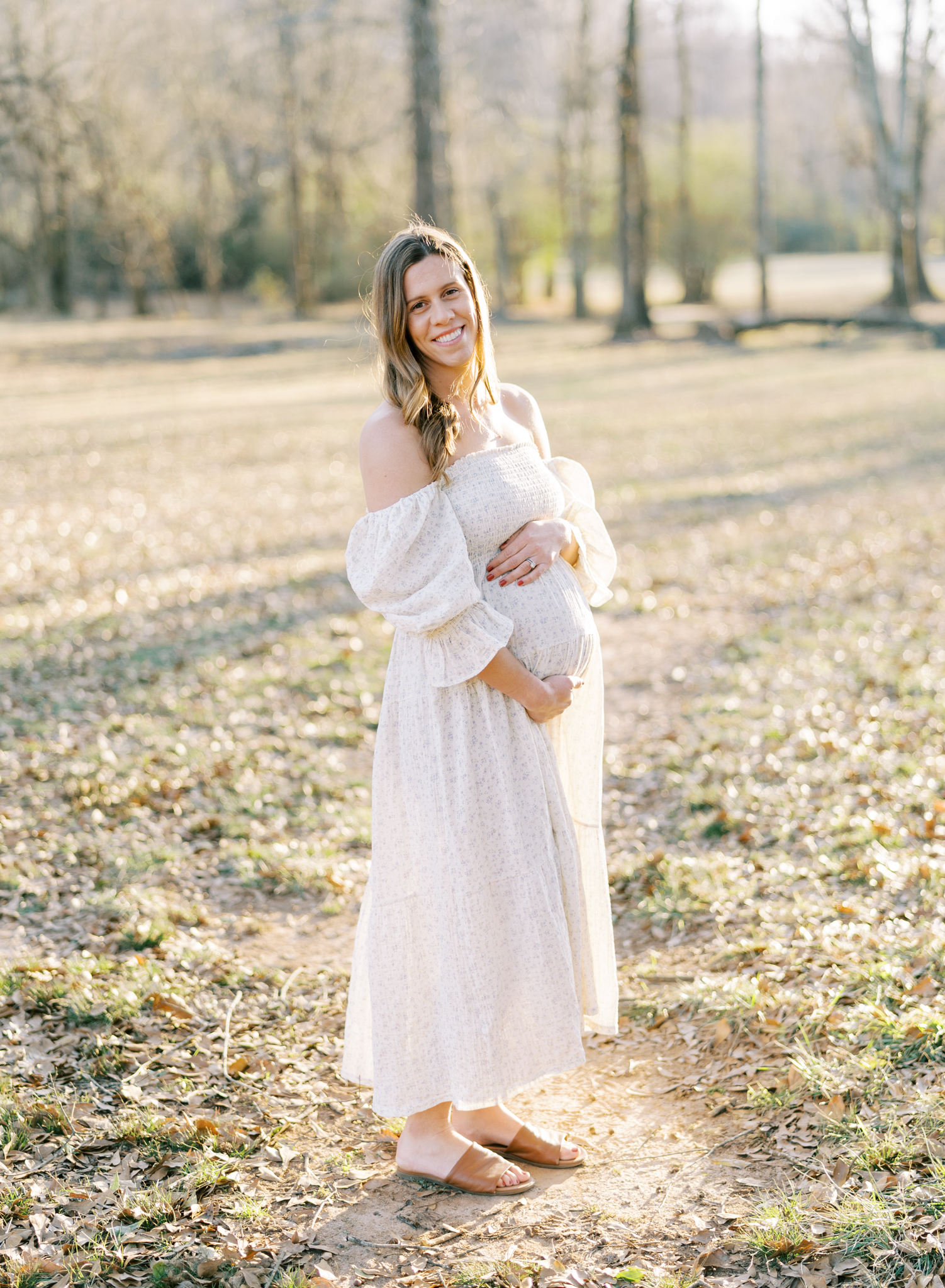 Glowing pregnant mother portrait by Cumming GA maternity photographer