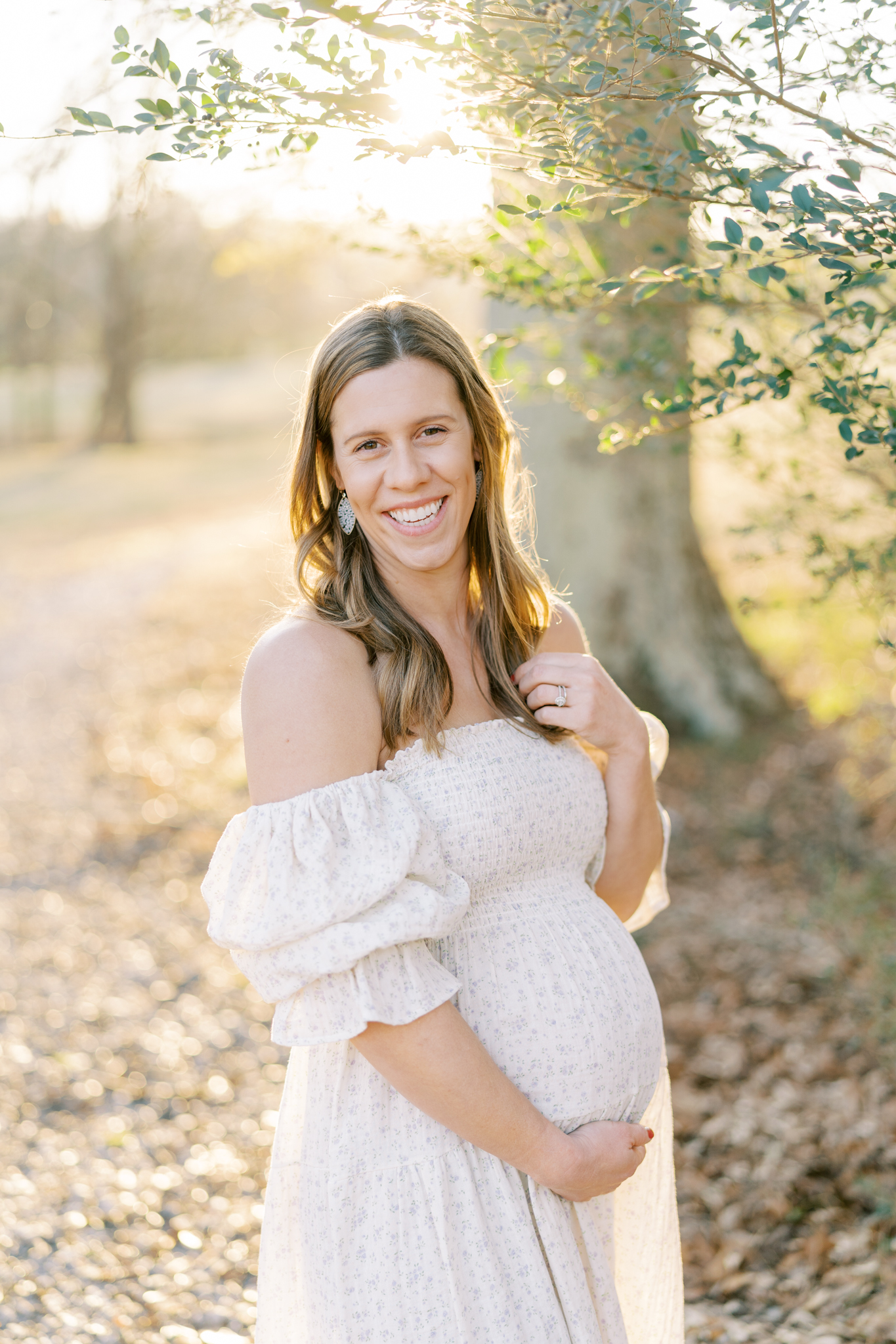 Glowing pregnant mother portrait by Cumming GA maternity photographer