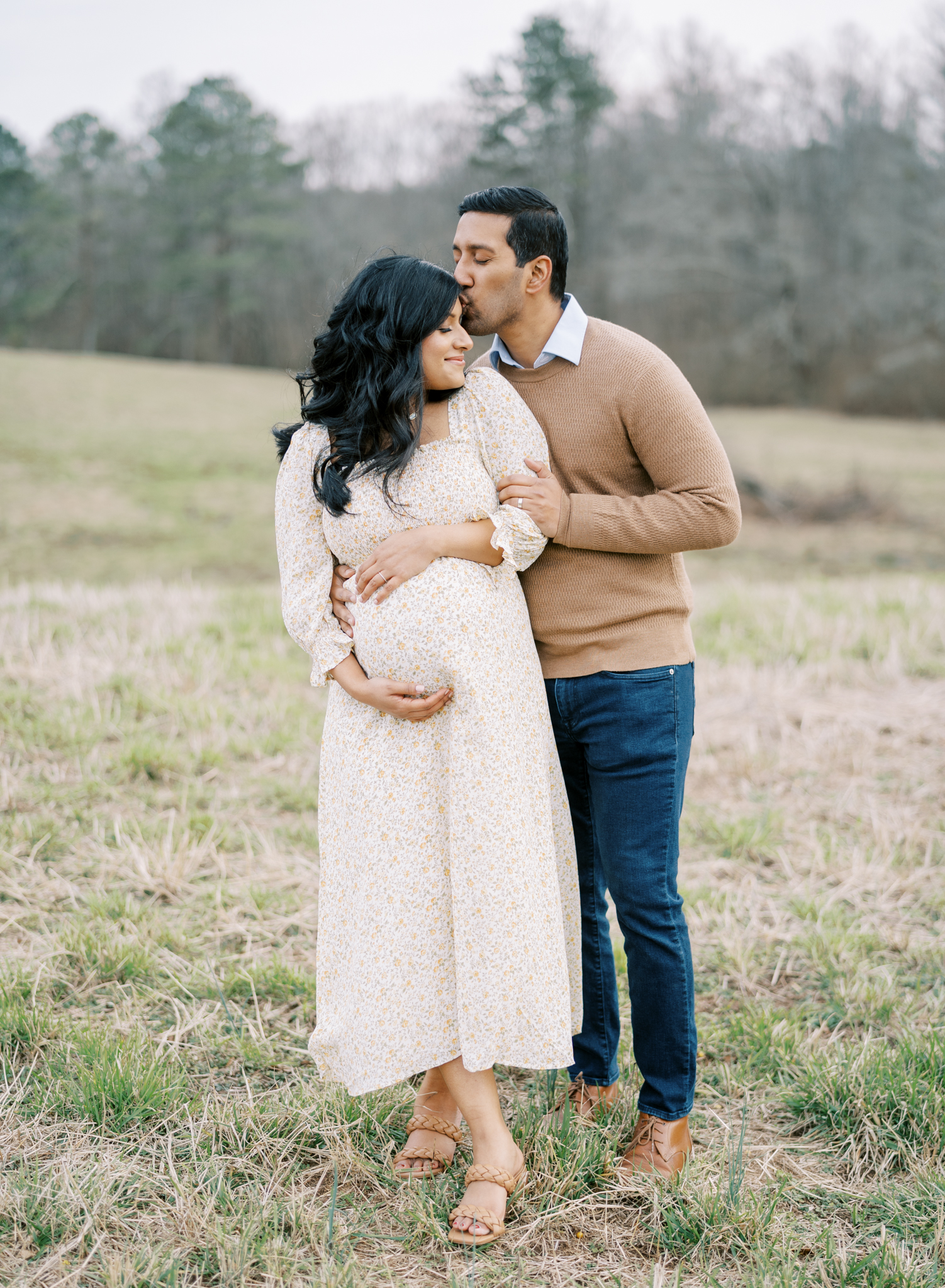 natural maternity photos in a field with husband 