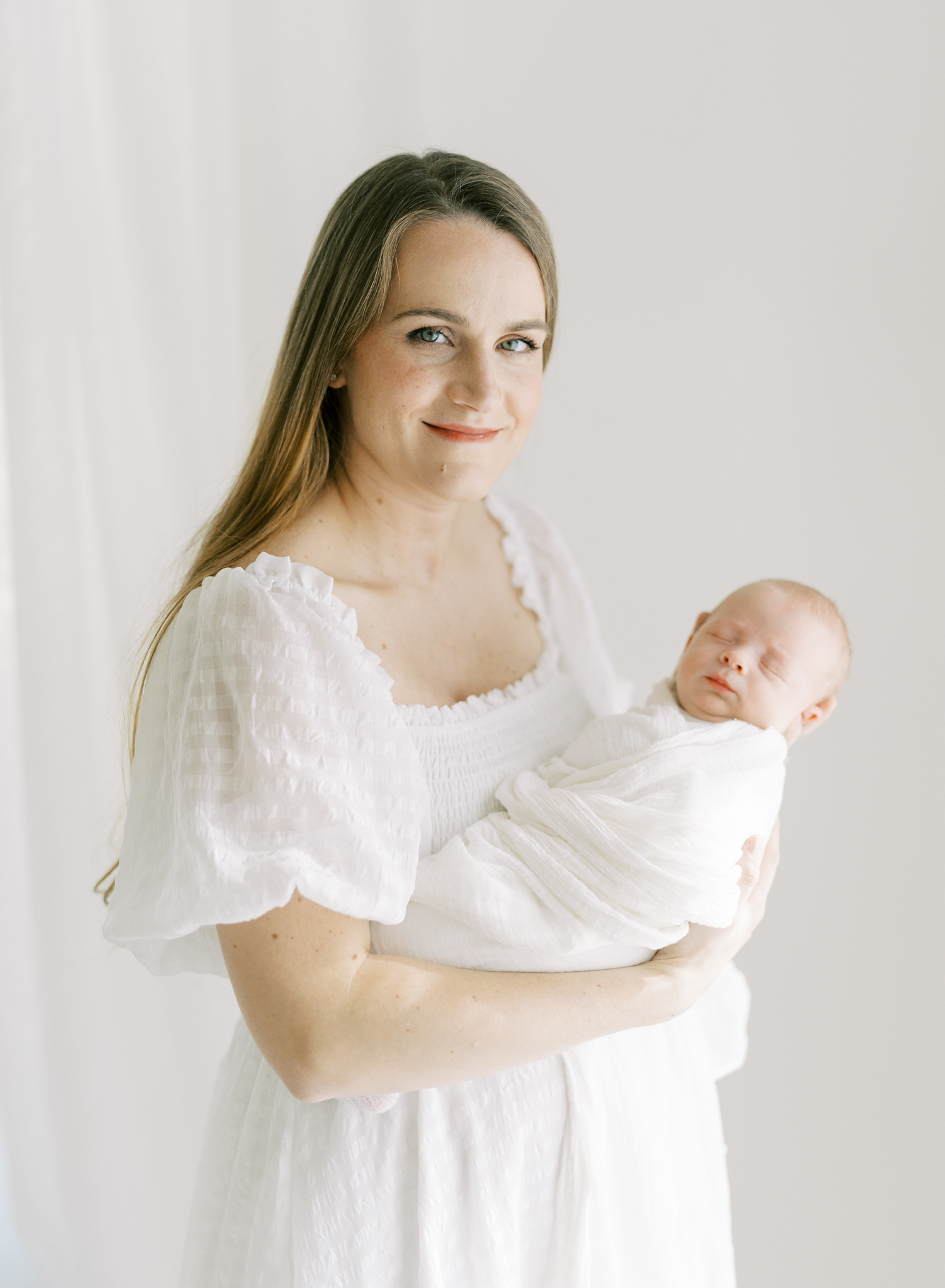 natural portrait of mother and newborn in dreamy studio newborn photos