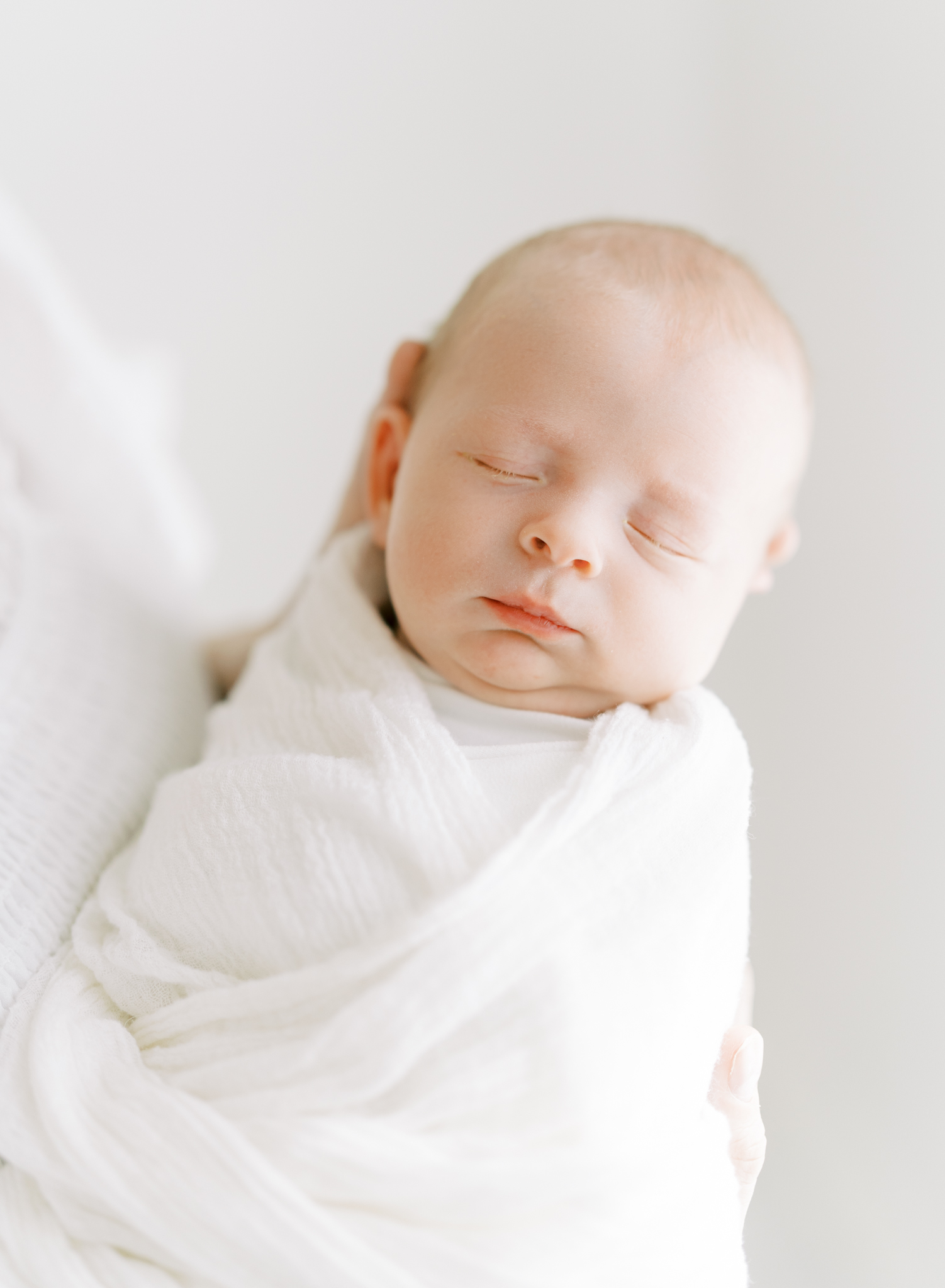dreamy glowing portrait of newborn baby boy