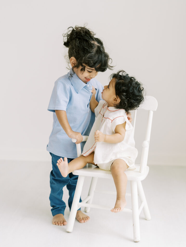 6 month baby girl with big brother in Atlanta photography studio.